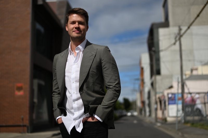 James Sackl, Australian founder and essayist, in Cremorne, Melbourne — hands in pockets, looking off-camera.