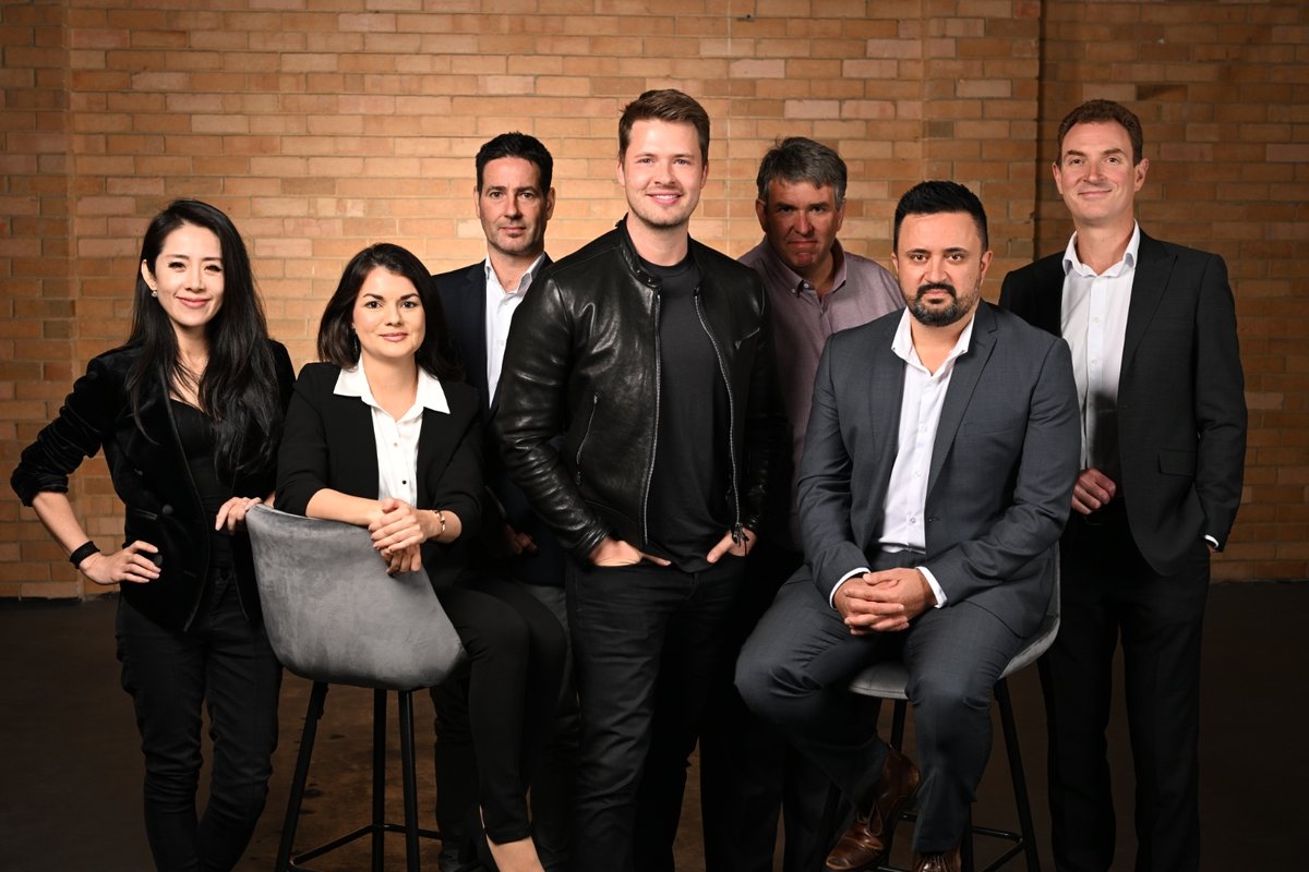 James Sackl with colleagues outside a Melbourne building — group photograph from the 2026 portrait session.